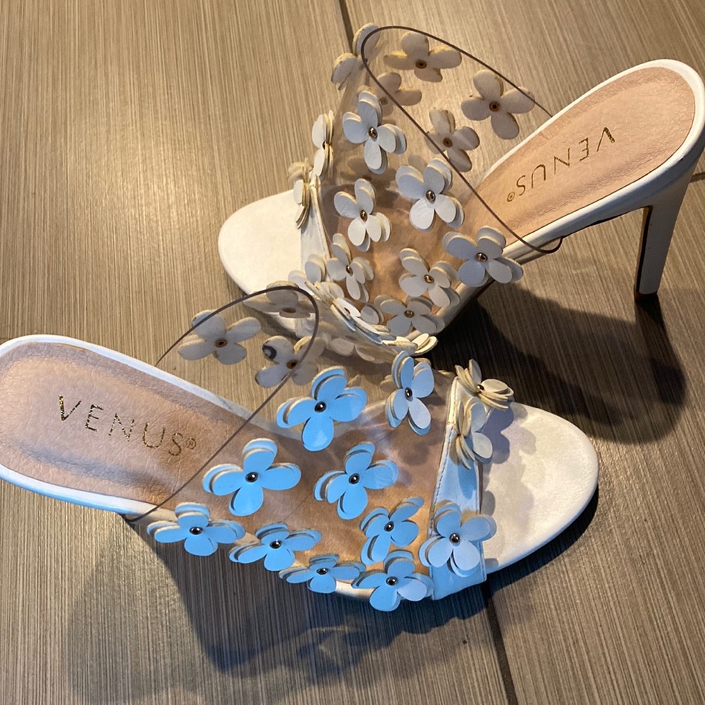 Venus heels with white flower embellishments.